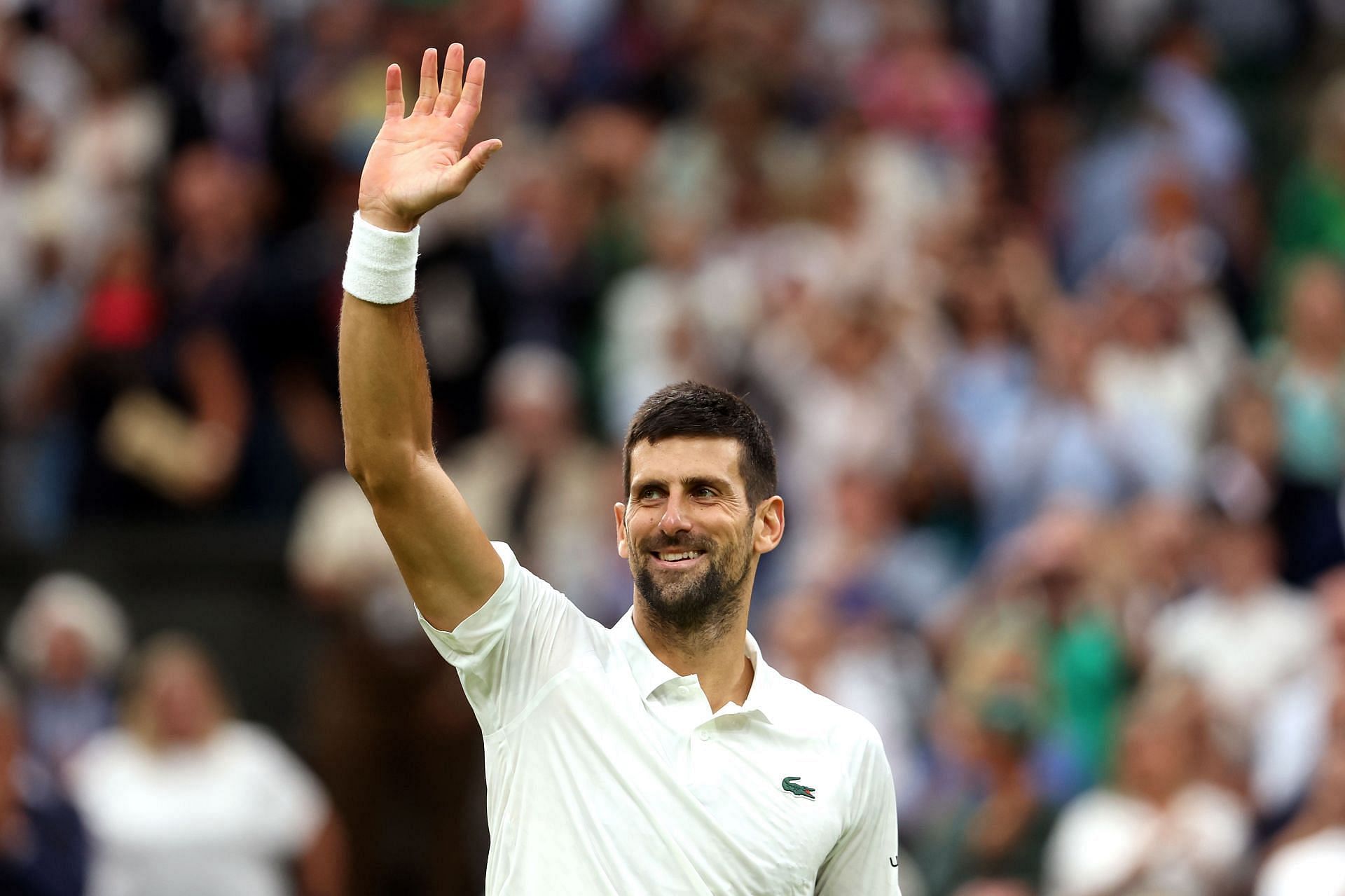 The 23-time Major winner waves to his fans at this year's Wimbledon